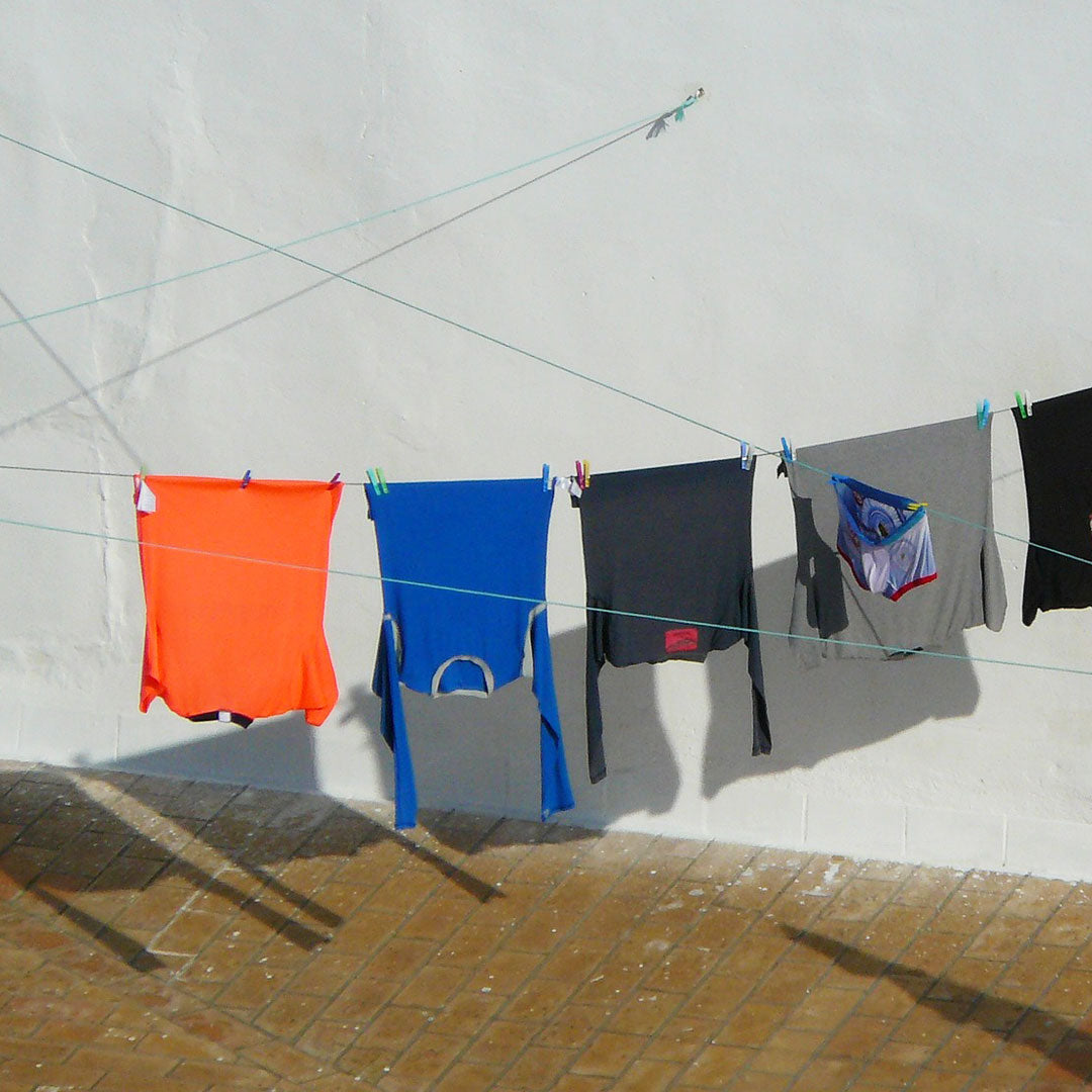 Washing line full of base layers drying in the sun