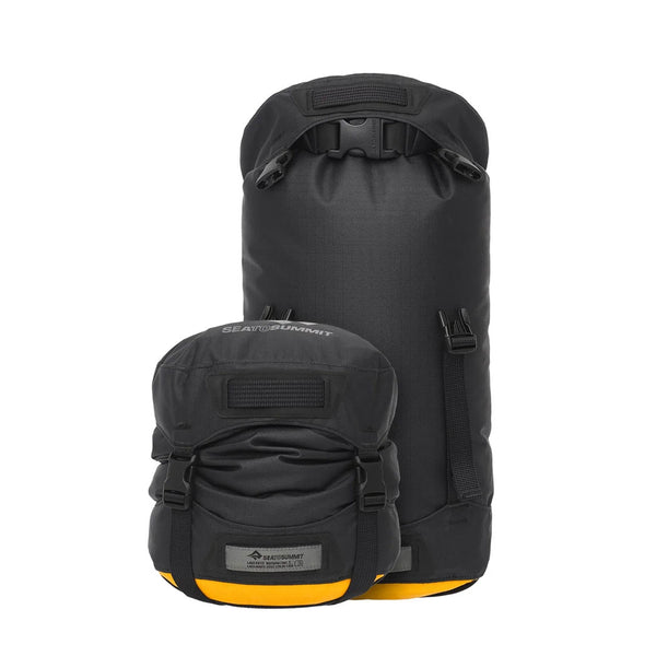 Sea To Summit Evac heavy duty compression dry bags showing the size difference between an umcompressed packed bag and a compressed one
