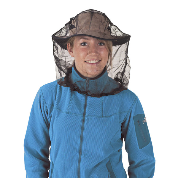 Woman wearing a Sea To Summit nano mosquito head net over the top of her wide brimmed sun hat