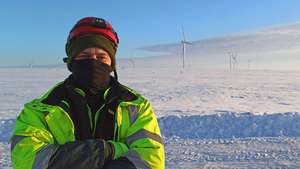 Man wearing his Sub Zero cold wethaer gear whilst working outside in the snow