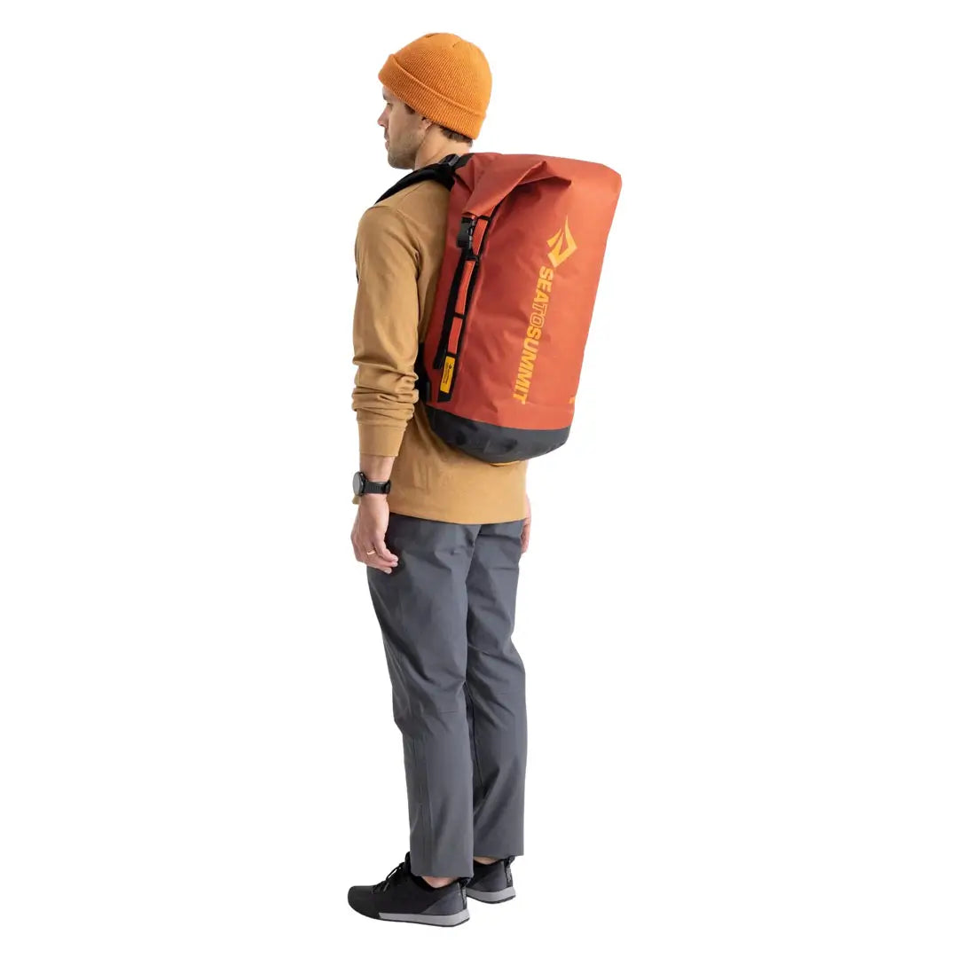 Back shot of a man wearing a Sea To Summit Big River Dry Backpack in 50 litres red 