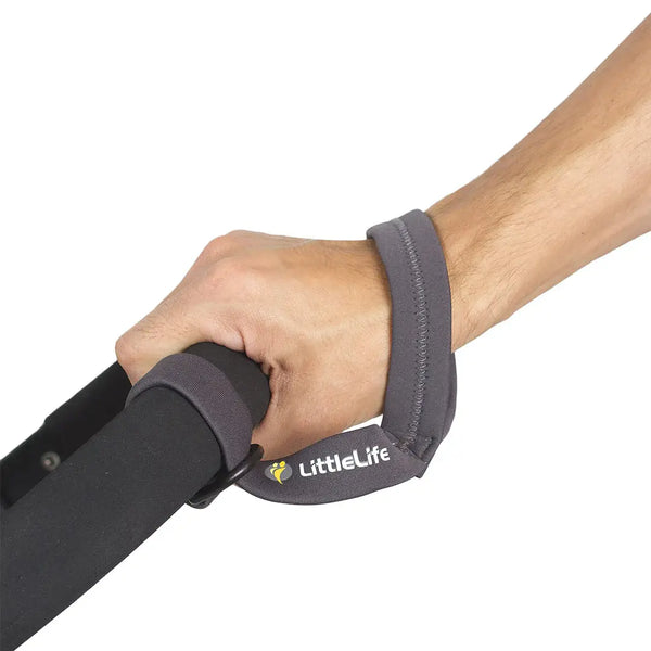 Littlelife buggy strap worn around a strollers handle and an adults wrist