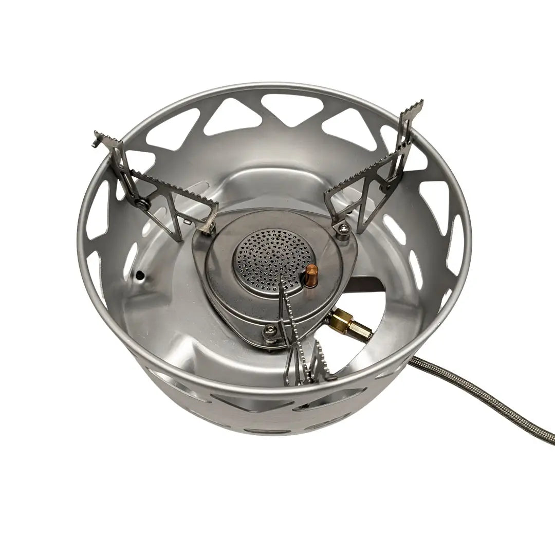 Birds eye view of the Primus Essential stove sets burner showing the integrated wind shield and gas hose