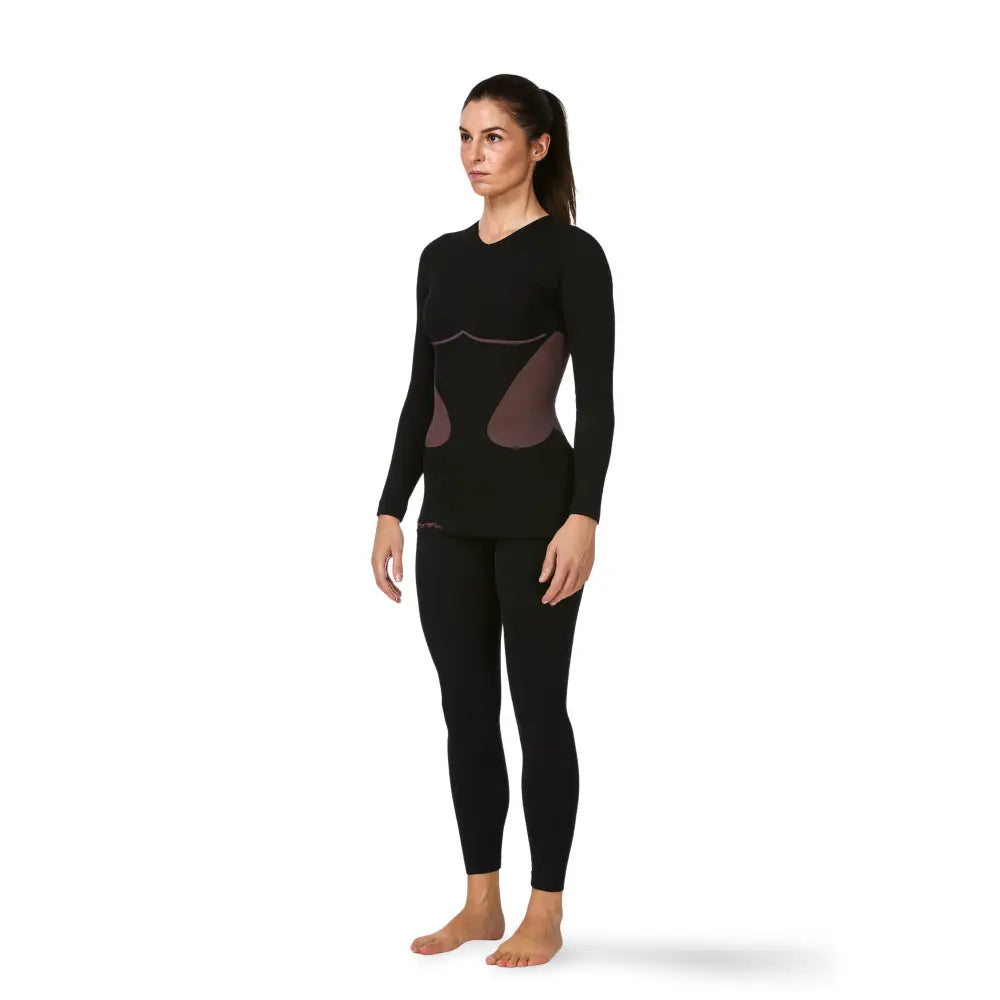 Woman wearing a Sub Zero Factor 1 Plus Womens Long Sleeve Base Layer Stretch Top Pink Black on a white background 