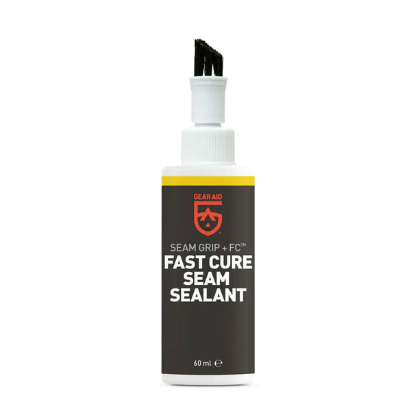 Gear Aid Seam Grip + FC Fast Cure Seam Sealant in a 60 ml bottle, featuring a dark gray label with a yellow stripe and red logo, topped with a white spray cap and black applicator tip.