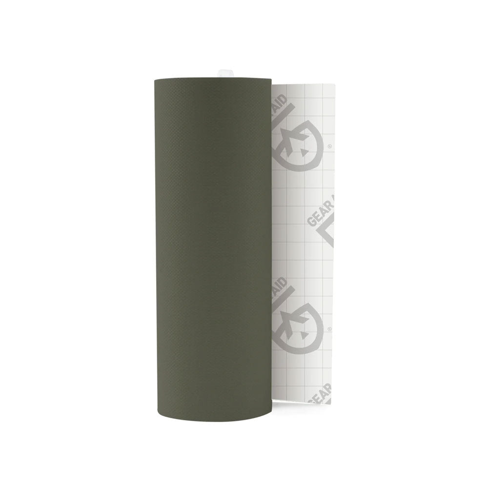 Roll of Gear Aid Tenacious repair tape in ripstop OD green showing part of the backing tape photographed on a white background