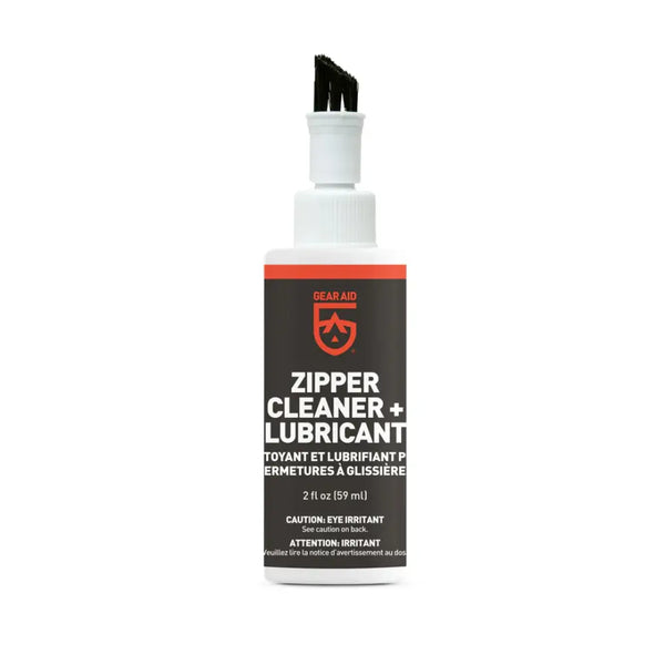 Bottle of Gear Aid zipper cleaner and lubricant with a white brush cap on a white background