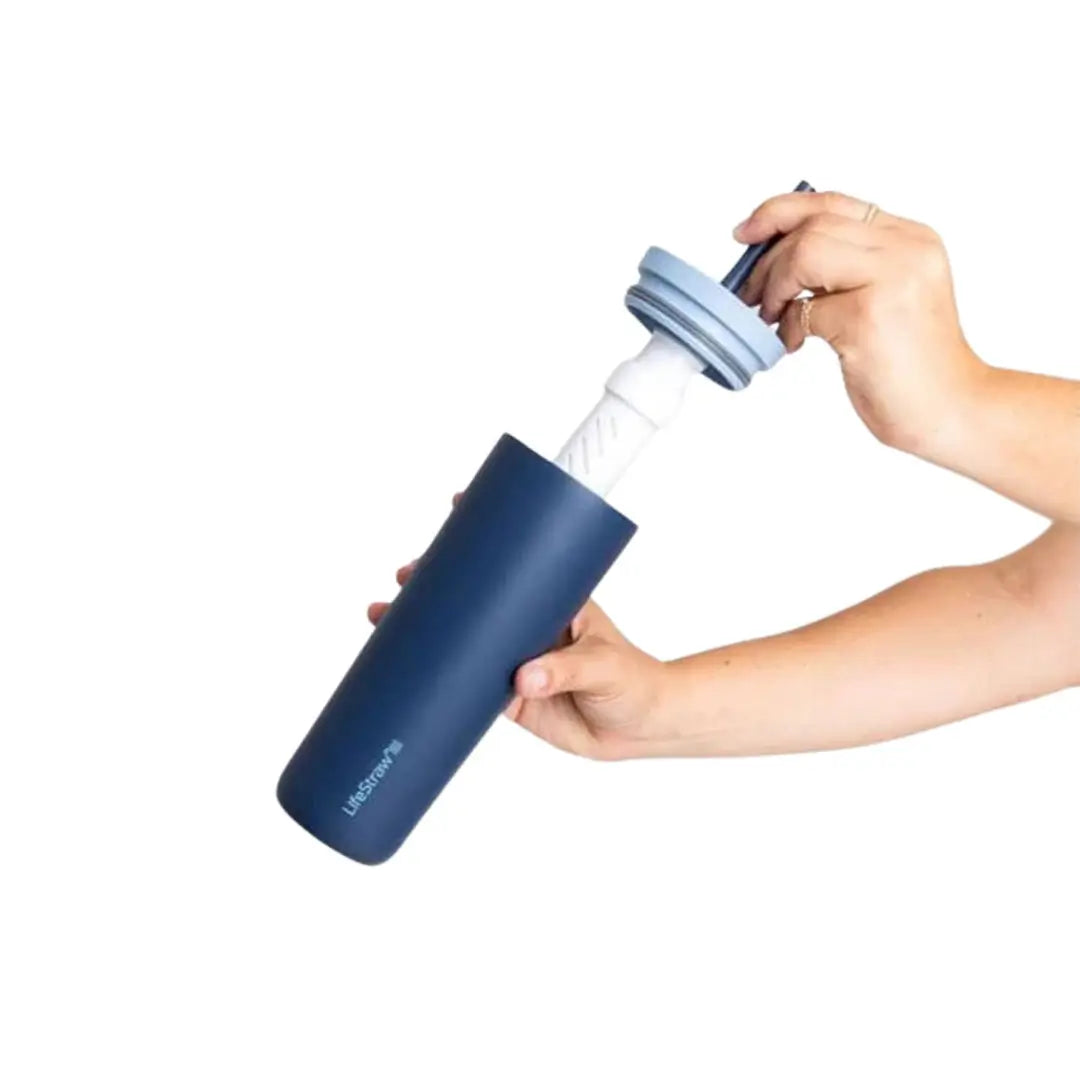 A person removing the straw and lid from a ifestraw Go Series 500ml insulated stainless steel water filter tumbler 