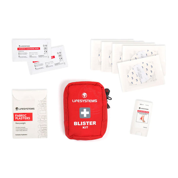 Lifesystems blsiter first aid kit pack and contents spread out on a white background
