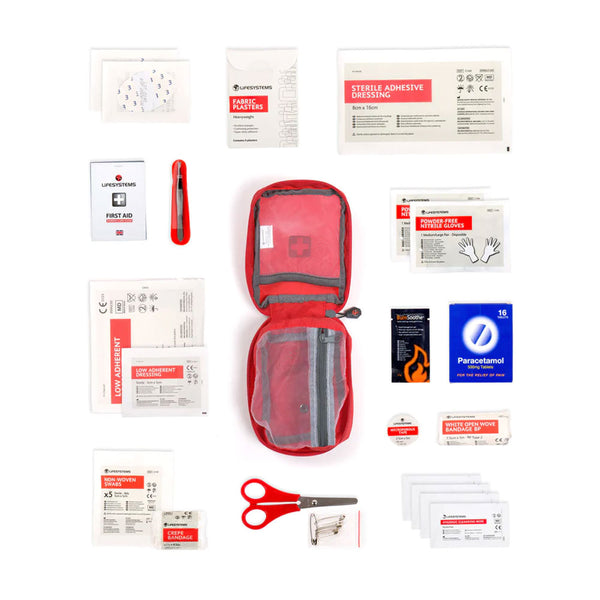 Studio shot on a white background of the contents of Lifesystems Trek first aid kit