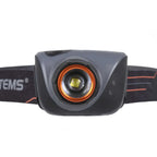 Front shot showing the LED lense of a Lifesystems 580 head torch on  a white background