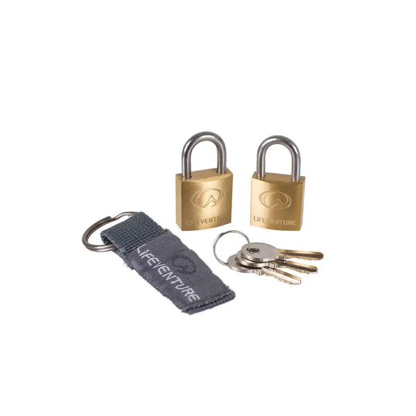 Two brass Lifeventure mini padlocks with keys and a strap on a white background