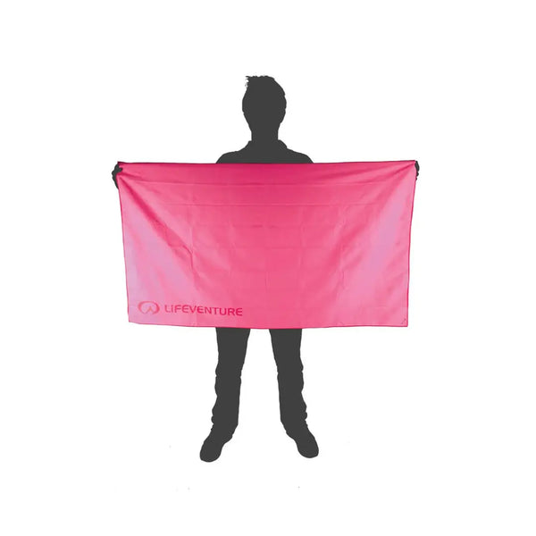 Pictorial image showing the relative size of a Lifeventure SoftFibre travel towel in xlarge pink in comparison to a person