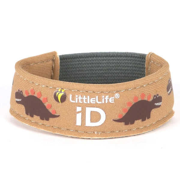 Studio shot on a white background of a Littlelife Identification wristband in the dinosaur pattern
