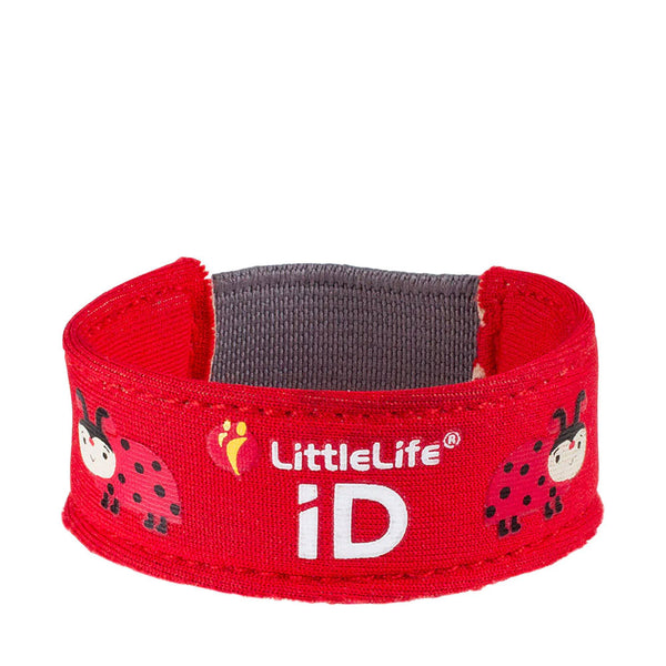 Studio shot on a white background of a Littlelife Identification wristband in the ladybird pattern