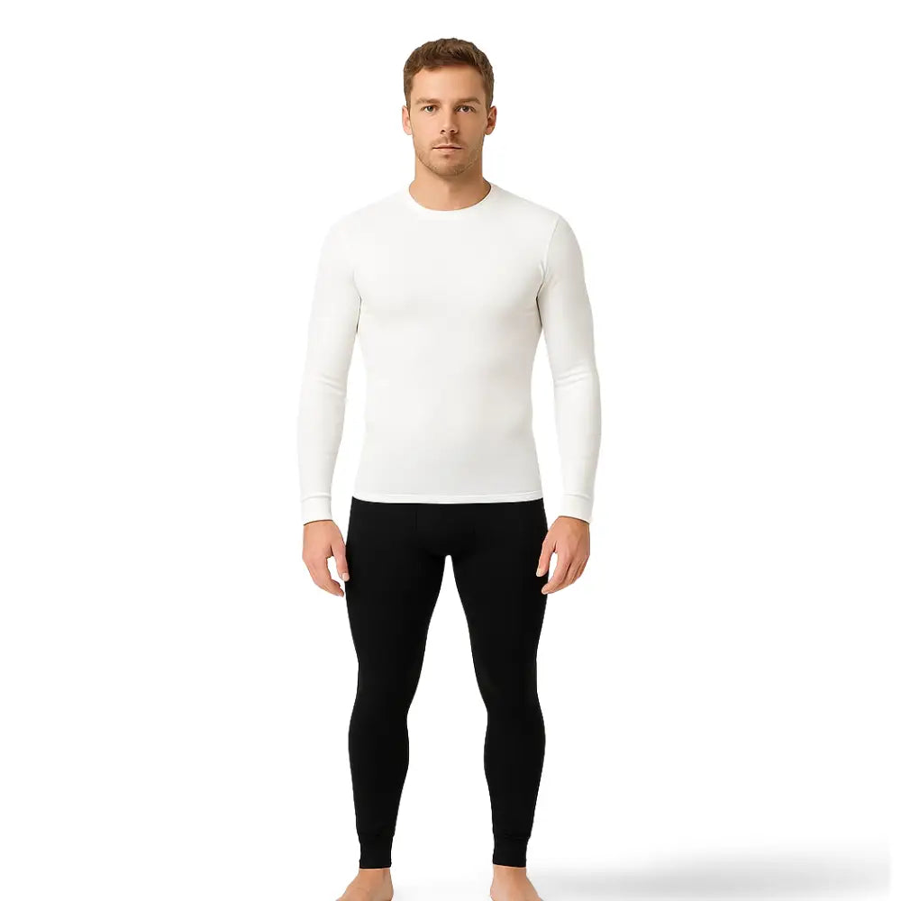 Studio shot of a man wearing a Sub Zero Classic long sleeve base layer thermal top in white on a white background