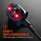 NEBO Mycro 450 rechargeable LED head torch connected to a USB-C charging cable, with red lights illuminated.