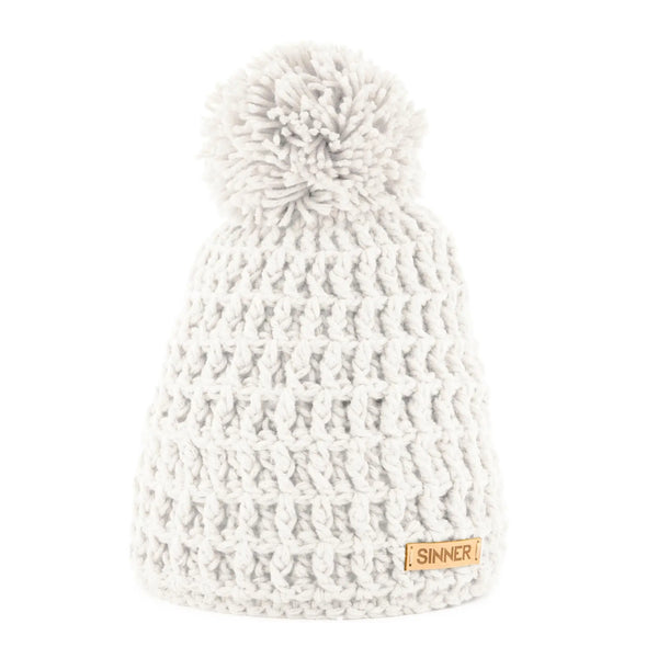 Front detail of a Sinner Nordic knitted beanie hat with a pompom in white