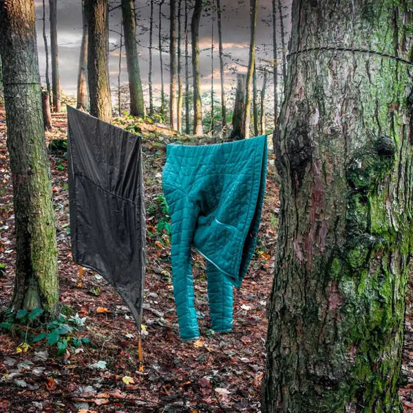 Lifesystmes reflective paracord used in the woods as a makeshift washing line