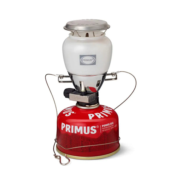 Primus Easy Light gas lantern sitting atop a Primus power gas canister on a white background