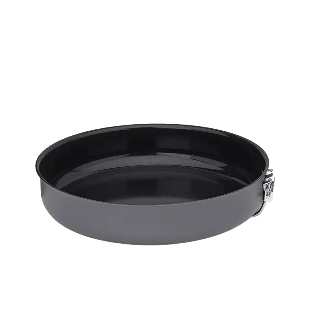 Small Primus Litech frying pan with the handle folded underneath showing the ceramic non-stick finish on a white background