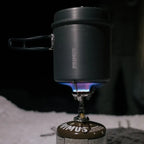 Primus Litech trek kettle ontop of a lit portable gas camping stoive in the snow