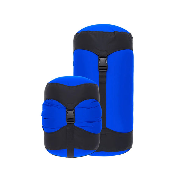 Sea To Summit lightweight compression sacks in Surf Blue colour showing the difference in size between compressed and non-compressed