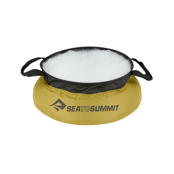 Sea To Summit portable kitchen sink filled with washing-up water