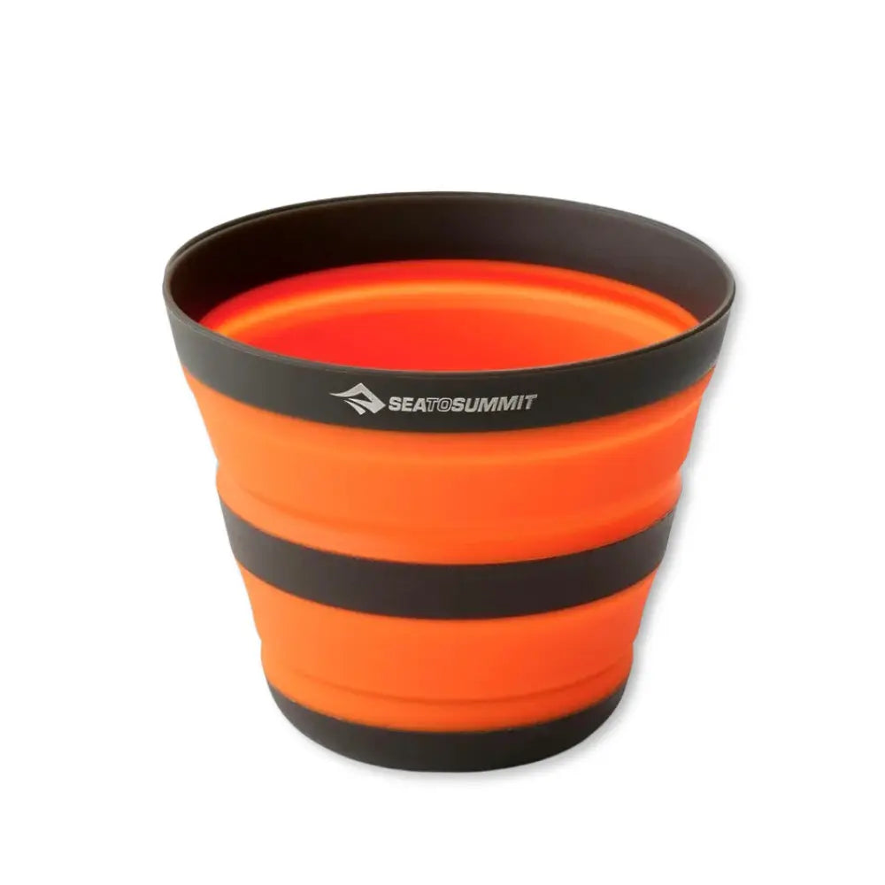 Collapsible Sea To Summit orange cup with black rim and Sea to Summit logo on a white background