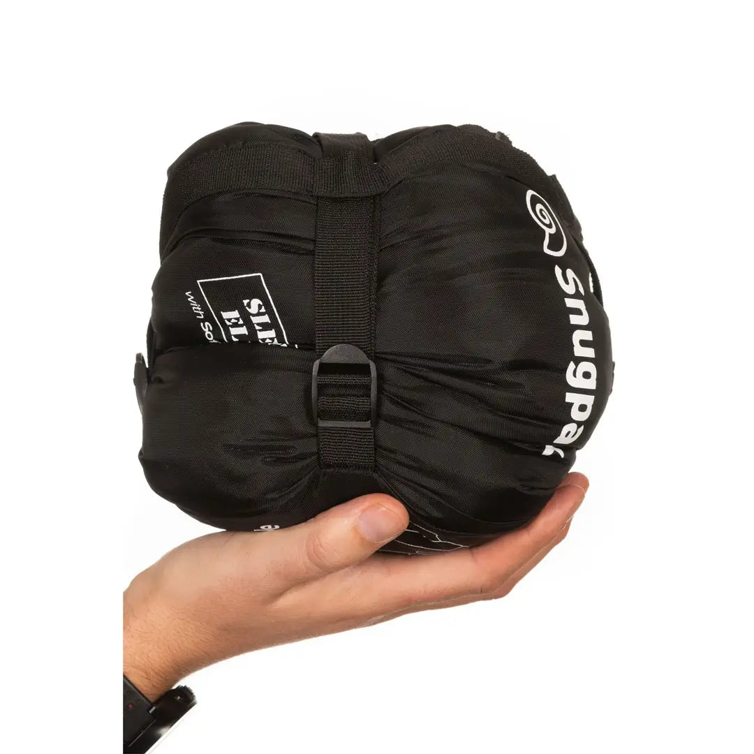 Studio shot of Snugpak Sleeka Elite Reversible insulated windproof jacket in black/olive packed in stuff sack
