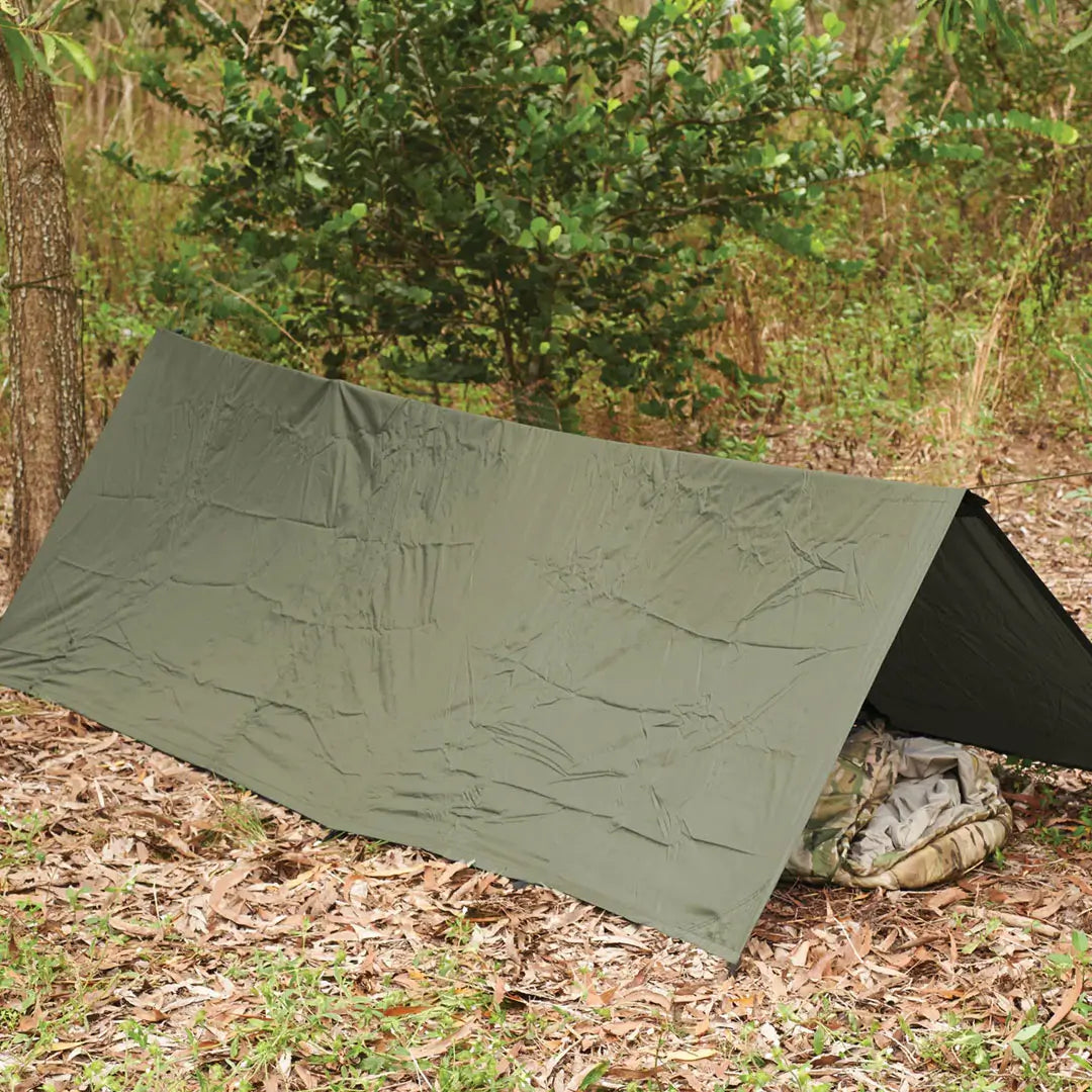 Snugpak Stasha G2 tarp shelter set-up outdoors in a tent configuration with a sleping bag inside