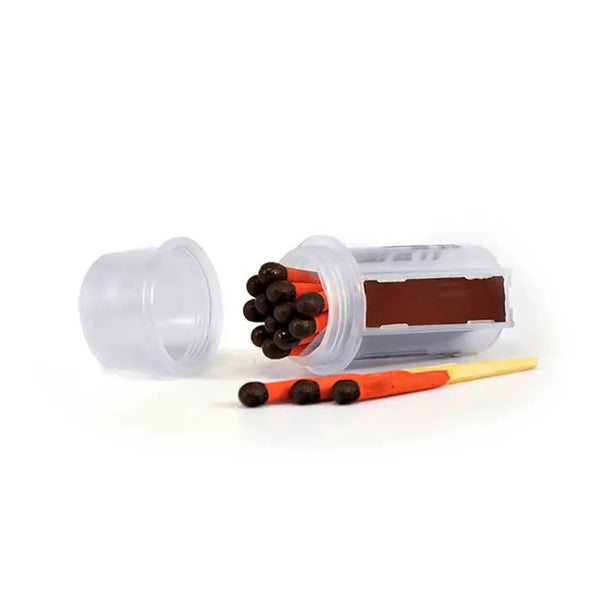 UCO Survival Stormproof Match Kit on its side with the screw cap removed 