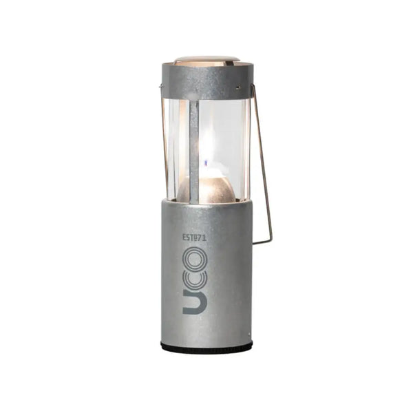 UCO Original Candle Lantern set-up with a lit candle in raw aluminium on a white background
