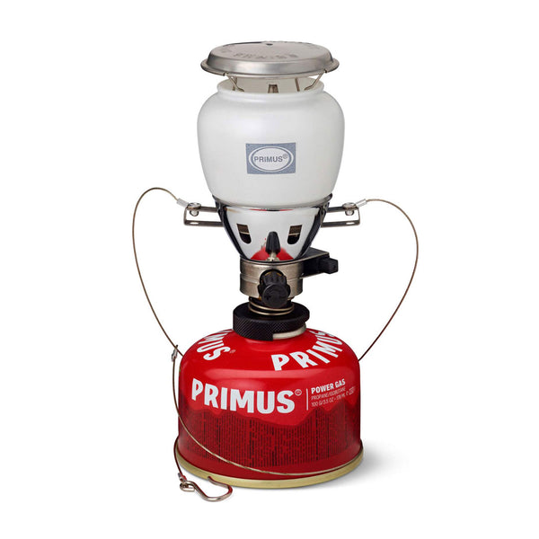 Studio shot on a white background of Primus Easy Light Duo Gas lantern sitting on a Primus Power Gas canister