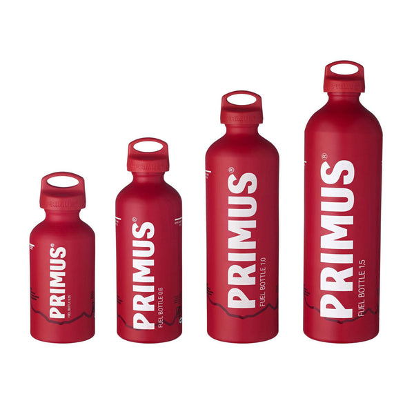 Studio shot on a white background of all the four size versions of Primus fuel bottles in red